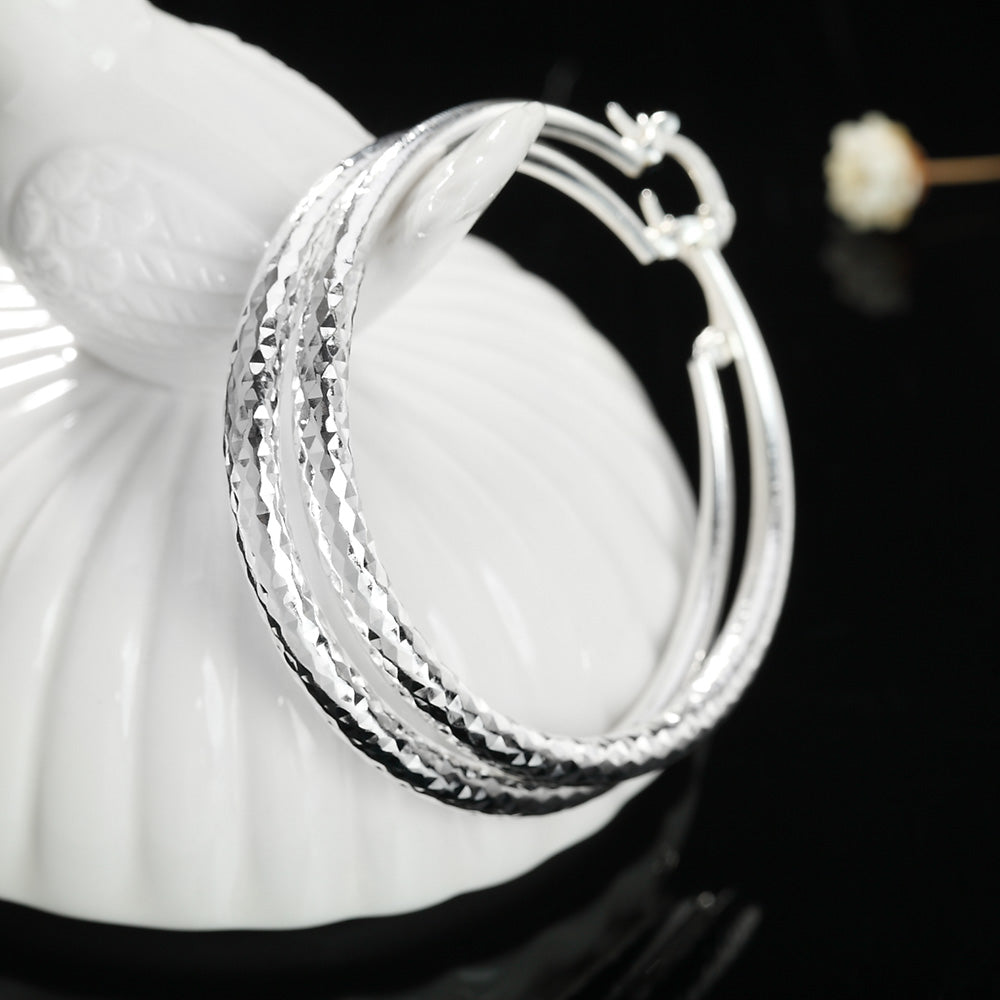 Boucle d'oreille créole en argent pour femme